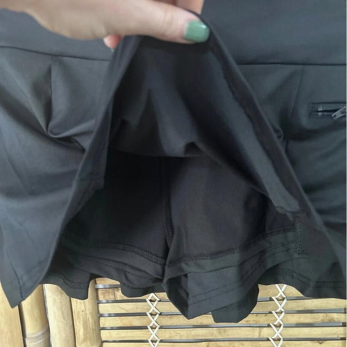 Black pleated skort with built-in shorts, size S