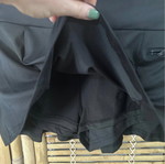 Black pleated skort with built-in shorts, size S