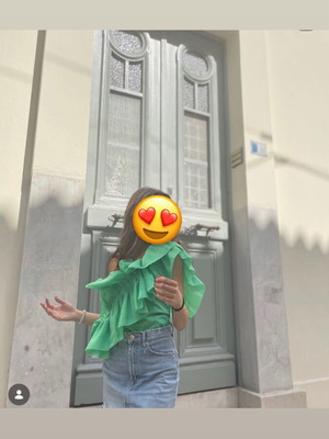 Green blouse with ruffles