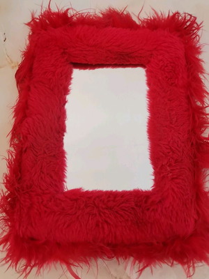 Table mirror used with synthetic fur and feathers
