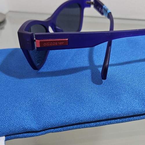 Adidas sunglasses new, purple frame with dark green lenses