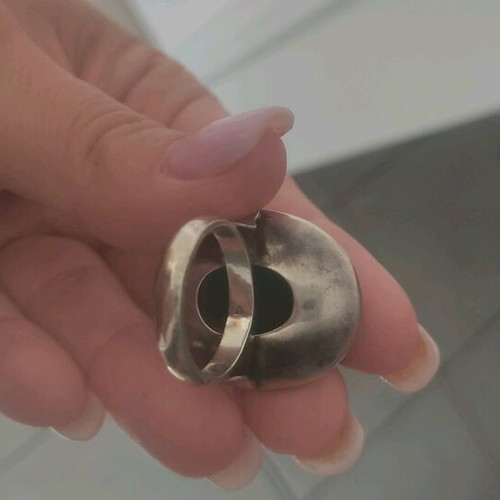 Silver large ring with petrol oval stone used