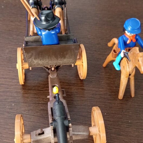 Playmobil Western toy with curved pole between horses