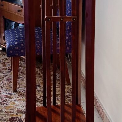 Handcrafted tall wooden plant stand with carved floral details