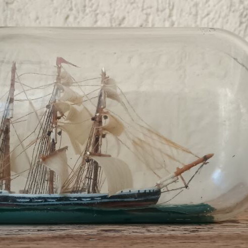 Vintage decorative ship in glass bottle used