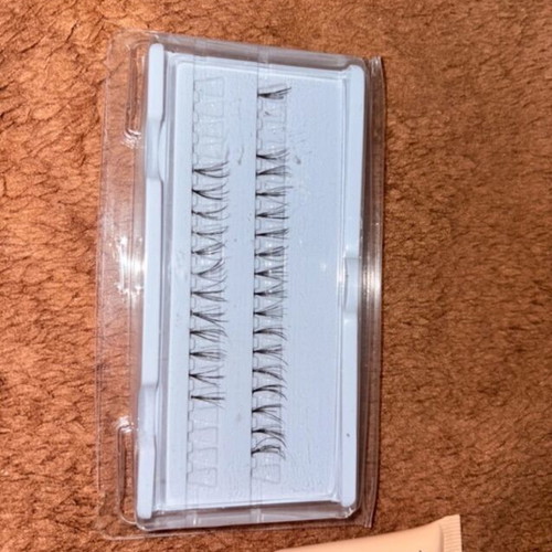 Eyelash tuferkia with adhesive used