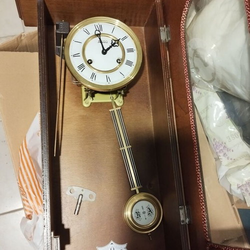 Wooden wind-up pendulum clock used with Asso mechanism