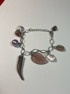 Bracelet with faux charms used, with wear