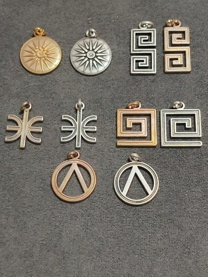 Vintage pendant set of 10 with Greek symbols and geometric designs, like new