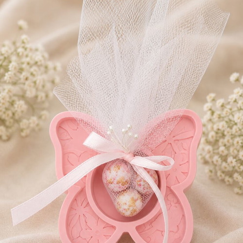 Handmade plaster butterfly bomboniere with three Hatzigiannakis crispy dragees