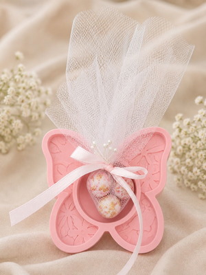 Handmade plaster butterfly bomboniere with three Hatzigiannakis crispy dragees