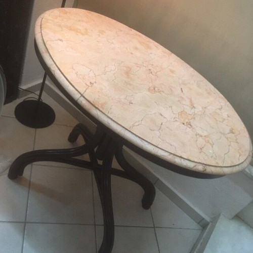 Vintage table with bent wood and oval salmon-pink marble used