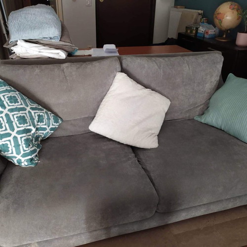 Two-seater sofa used with light gray velour fabric