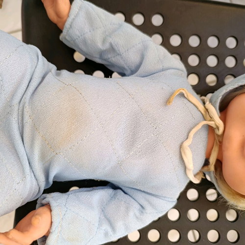 Vintage baby doll used with missing parts and wear
