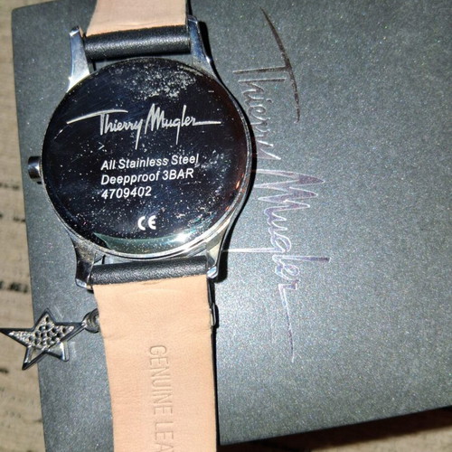 Thierry Mugler wristwatch with leather strap and silver star charm