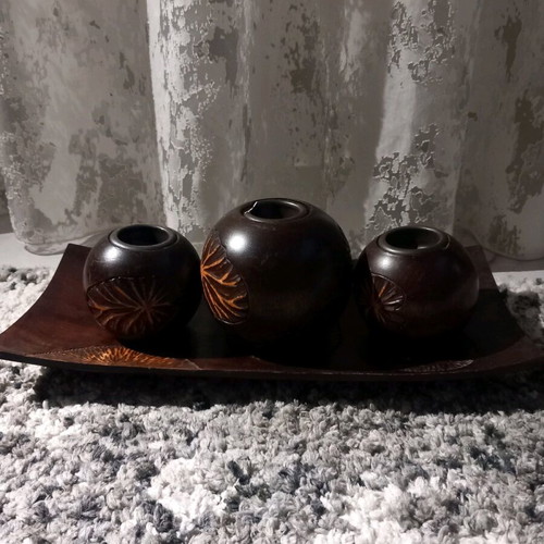 Plate with three wooden candlesticks used