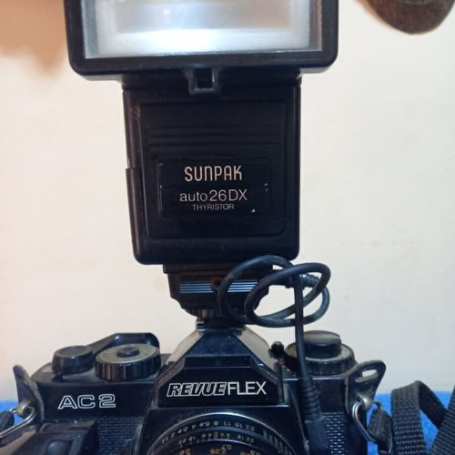 Revueflex AC2 35mm SLR film camera used with Sunpak Auto 26 DX flash