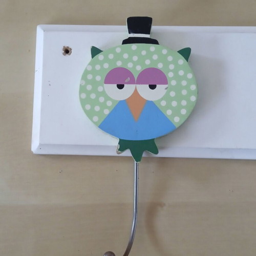 Wooden children's wall clothes hanger with three owl figures used