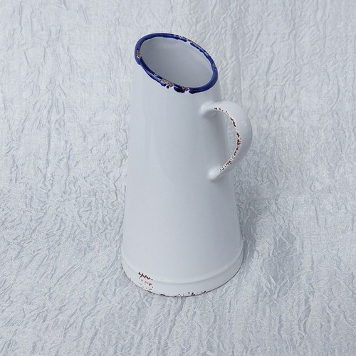 Ceramic jug like new resembling oxidized tin vessel