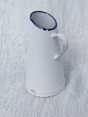 Ceramic jug like new resembling oxidized tin vessel