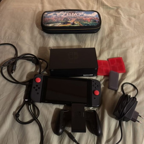 Nintendo Switch console with carrying case and Pokemon Sword game