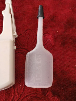 Sewing Machine Accessories Set like new with Needles, Button-Mate Tool & Oil