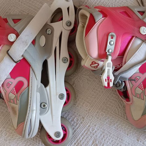 Roller skates used, size 33-36 with helmet and protective gear