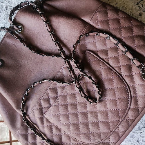 Backpack like new with quilted texture and handles