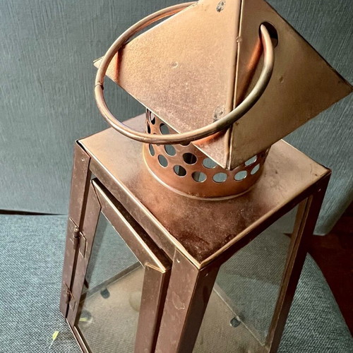 Metal candle lantern used, copper color