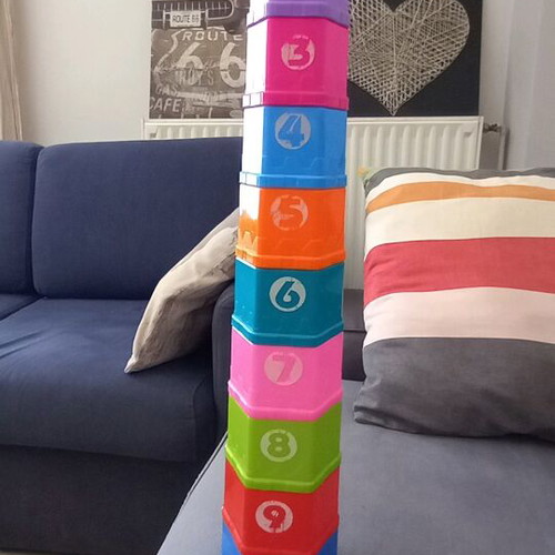Activity toy pyramid with cups used