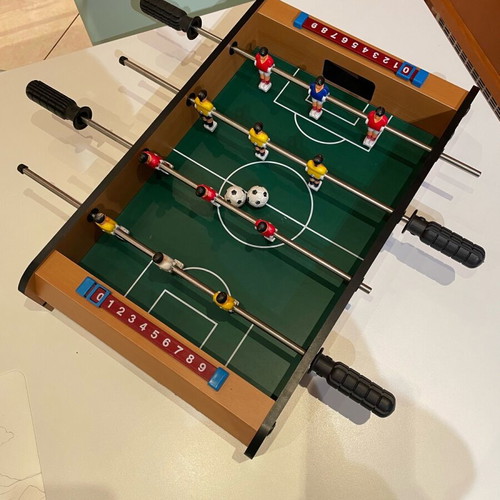 Foosball table used with two balls in excellent condition