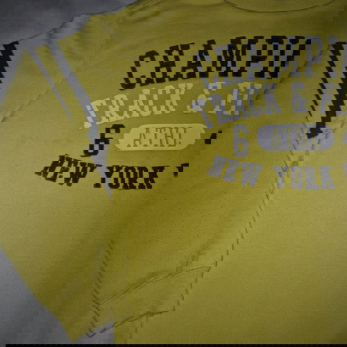 Champion yellow sweatshirt used for 9-10 years with blue print