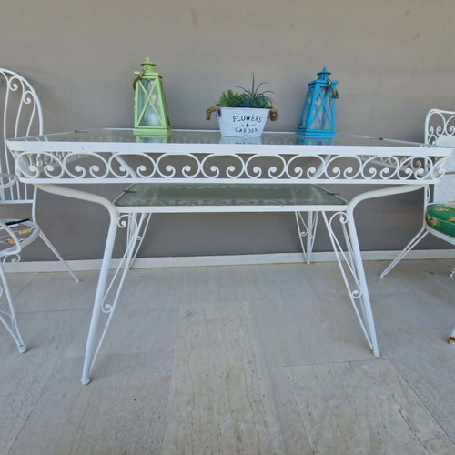 Wrought Iron Outdoor Set used, 4 chairs, 1 armchair, glass table