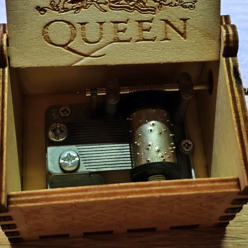 Wooden Queen Music Box like new with hand crank and engraved design