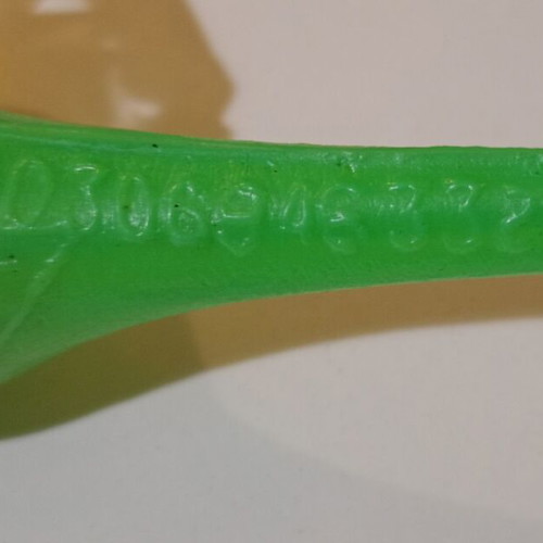 Plastic bird-shaped whistle used, green color