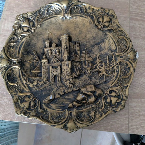 Decorative ceramic plate used with embossed design