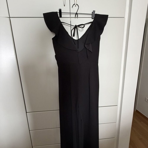 Jumpsuit with ruffles one size like new, black