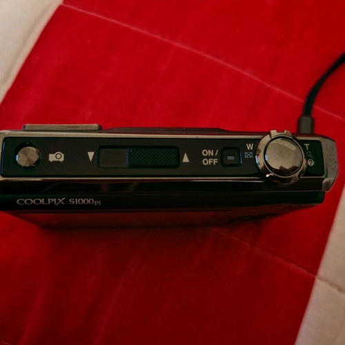 Nikon Coolpix S1000pj digital camera 12MP used with built-in projector