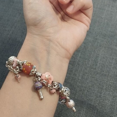 Women's bracelet with charms and pink beads like new