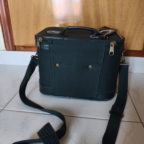 Toiletry bag used, green, fabric defect