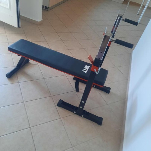 X-FIT gym bench like new with barbell stands