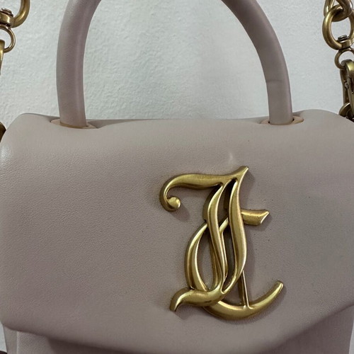 Juicy Couture small crossbody bag nude color with gold design like new