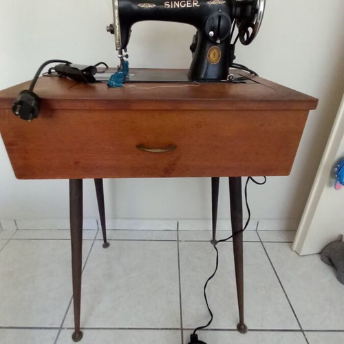 Singer sewing machine used with table