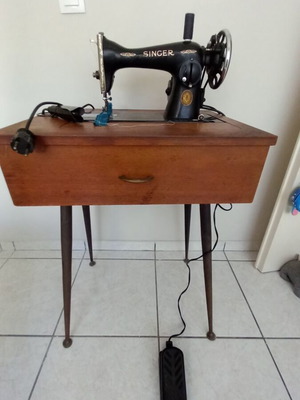Singer sewing machine used with table