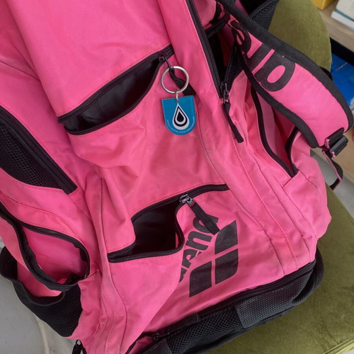 Arena pool bag with compartments used, fuchsia color