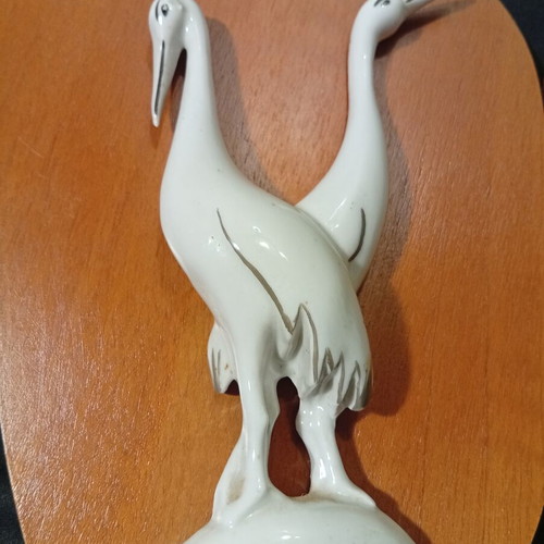 Wall panels used with wooden base and porcelain swallows and storks