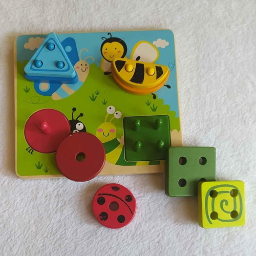 HAPE wooden sorting toy used with colors and shapes
