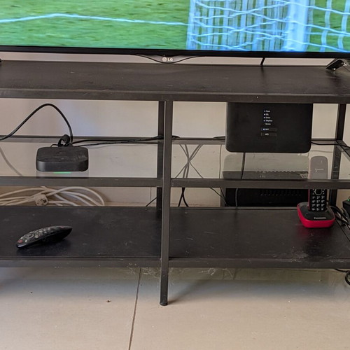 Metal TV stand with shelves used