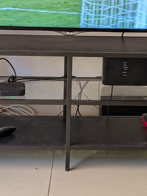 Metal TV stand with shelves used
