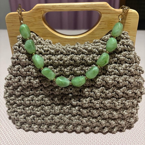 Handmade knitted beige bag with wooden magnetic clasp and beaded handle